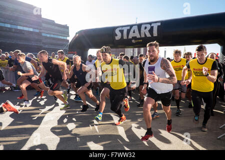 Cardiff Bay, Wales, UK - September 25, 2015: First wave takes off at World's biggest 10k obstacle race in Cardiff Bay. Stock Photo