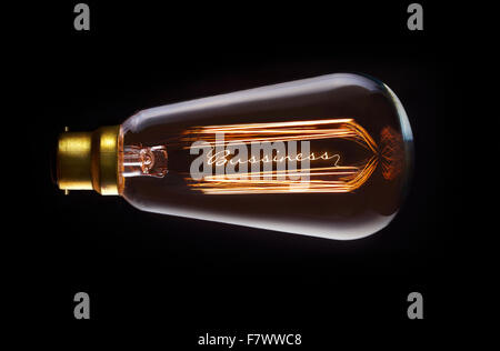 Business Success concept in a filament lightbulb. Stock Photo