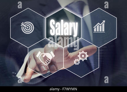 Businessman pressing an Salary concept button. Stock Photo