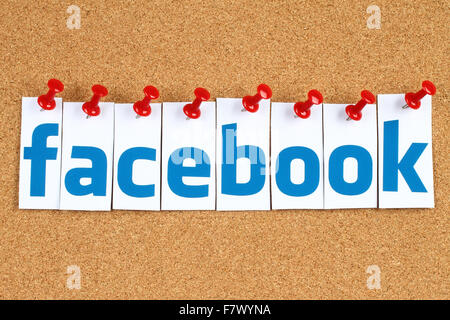 Kiev, Ukraine - October 07, 2015: Facebook logo sign printed on paper, cut and pinned on cork bulletin board. Stock Photo