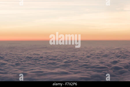 Fluffy clouds seen from mount fuji at sunrise, Honshu, Japan Stock Photo