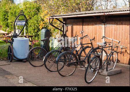 Old style vintage bikes parked on the train platform of Sheringham Railway Station in Norfolk. Stock Photo