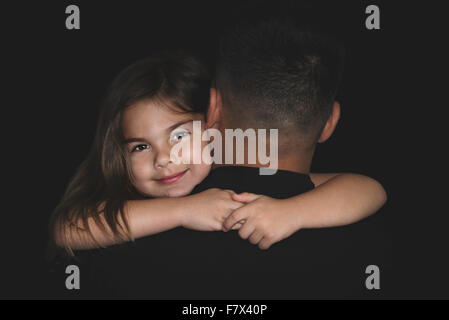 Girl hugging her father Stock Photo