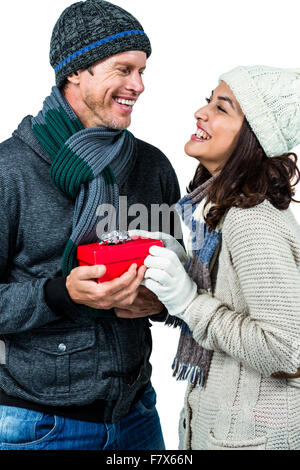 Festive couple exchanging a gift Stock Photo