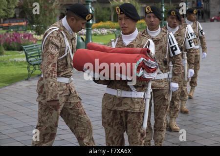 A group of military prepares to hoist the flag of Peru in the main square of Cuzco Stock Photo