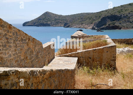 Venetian fortifications on the Cretan island of Spinalonga, eastern Crete.  With a view of the mainland beyond. Stock Photo
