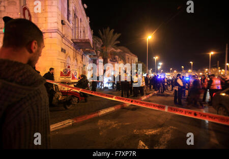 Jerusalem, Palestinian Territory. 3rd Dec, 2015. Israelis stand behind the police line near the scene following a stabbing attack near Jerusalem's Old City on December 3, 2015. A Palestinian attacker stabbed and wounded an Israeli policeman near Jerusalem's Old City before being shot and ''neutralised'', Israeli police said Credit:  Mahfouz Abu Turk/APA Images/ZUMA Wire/Alamy Live News Stock Photo