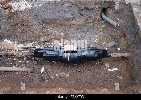 Underground pipe repair on a UK street Stock Photo - Alamy