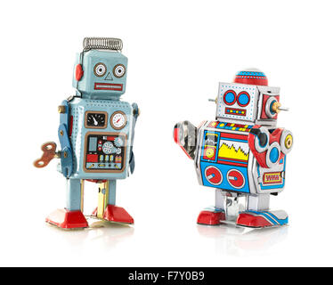 Two Retro Tin Robots on a White Background Stock Photo