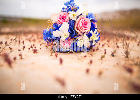wedding bouquet on the ground at sunset Stock Photo