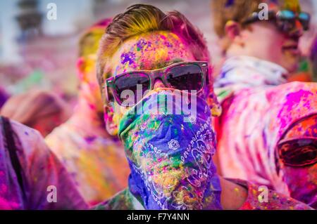 A young man covered in colored powder during the Holi Festival of Colors at the Sri Sri Radha Krishna Temple March 29, 2014 in Spanish Fork, Utah. The festival follows the Indian tradition of Holi and attracts over 80,000 people. Stock Photo