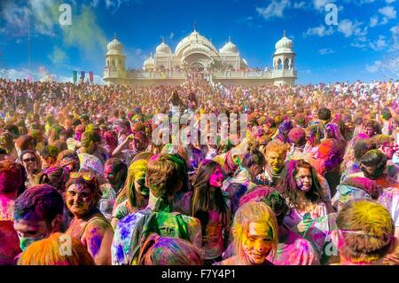 Thousands of people throw colored powder into the air during the Holi Festival of Colors at the Sri Sri Radha Krishna Temple March 30, 2013 in Spanish Fork, Utah. The festival follows the Indian tradition of Holi and attracts over 80,000 people. Stock Photo