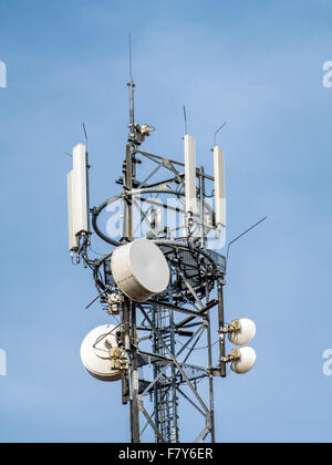 Telecommunications tower over blue sky Stock Photo