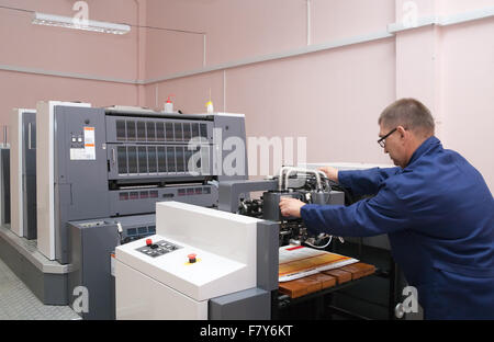 Offset Machine Working Printer working at his new offset machine Stock Photo - Alamy