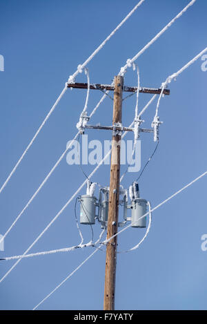 Utility pole and lines on a frosty morning in Oregon's Wallowa Valley. Stock Photo