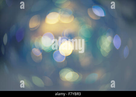 Christmas background. Festive xmas abstract wallpaper with bokeh defocused lights and spots of color Stock Photo