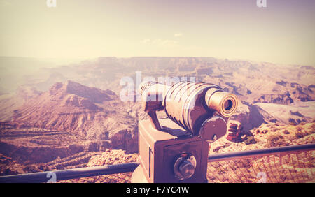 Vintage toned telescope pointed at Grand Canyon, travel concept, USA. Stock Photo