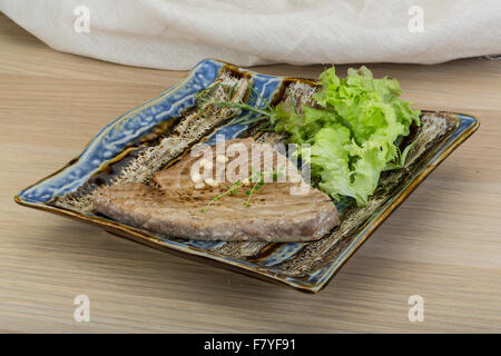 Grilled tuna steak with rosemary and cedar nut Stock Photo