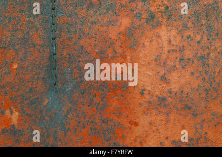 Rusty background , rusted metal texture and chain - red wall Stock Photo