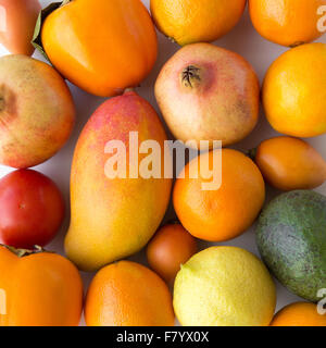 fruits and vegetables closeup - food macro / closeup of oranges, avocado, mango, tomato, kaki, apple, Stock Photo