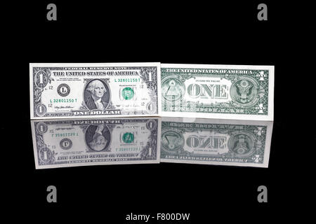 one dollar bill as well as the front and the back with reflection Stock Photo