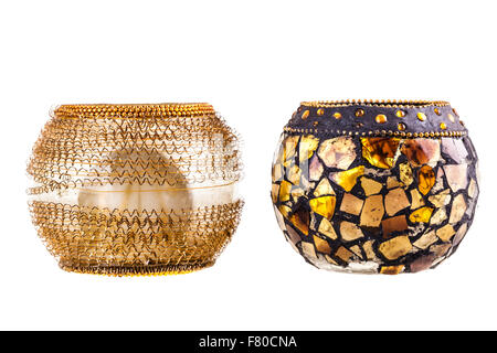 two golden modern candle holders isolated over a white background Stock Photo