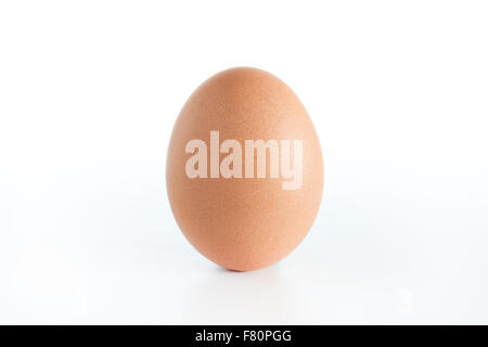 A chicken egg, upright and isolated on white background. Stock Photo