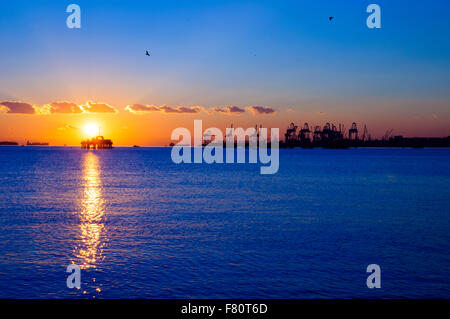 Offshore oil rig silhouette on the sunset in Istanbul Stock Photo