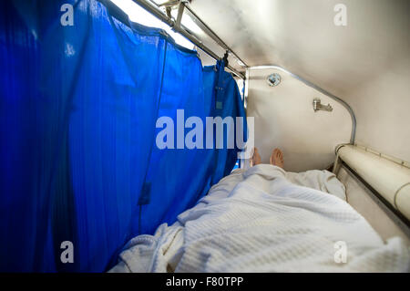 In bed on the Bangkok to Chiang Mai overnight sleeper train Stock Photo