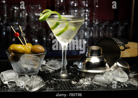 martini cocktail on the table with olives Stock Photo