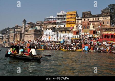 Pilgrims at Munshi Ghat to take dip in Holy River Ganges during Kumbh Mela in Varanasi one of the seven Sacred Cities of Hindus Stock Photo