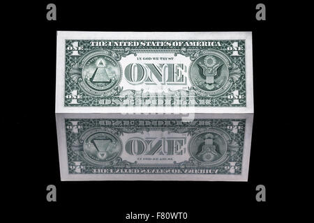 one dollar bill as well as the front and the back with reflection Stock Photo