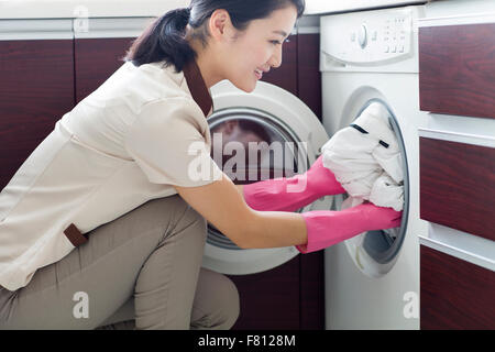 Domestic staff doing laundry Stock Photo