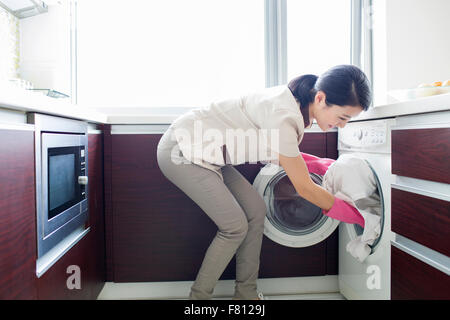 Domestic staff doing laundry Stock Photo