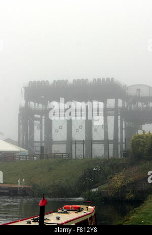 the Cathedral of the waterways, The Anderton Boat lift looms through the mist over the River Weaver in Cheshire. Stock Photo