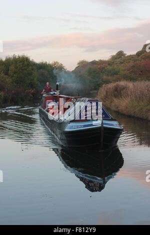 A traditional working narrow boat on the Trent and Mersey canal near Dutton in Cheshire. Stock Photo