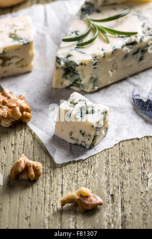 Blue cheese with nuts on wooden table Stock Photo