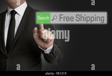 Free shipping browser is operated by businessman concept. Stock Photo