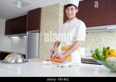 Chef providing cooking service in customer's home Stock Photo