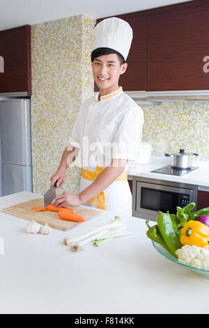 Chef providing cooking service in customer's home Stock Photo