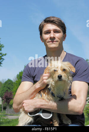 terrier dachshund mixed-breed with dog owner Stock Photo