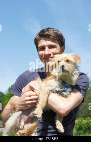 terrier dachshund mixed-breed with dog owner Stock Photo