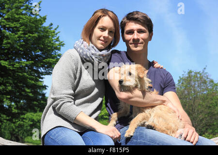 terrier dachshund mixed-breed with dog owners Stock Photo