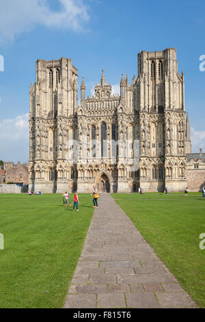 Exterior of Wells Cathedral, with unidentified people, is the seat of the Bishop of Bath and Wells. Stock Photo