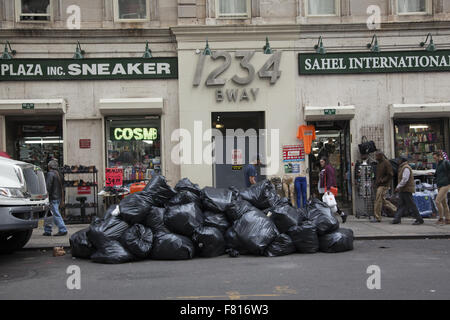 Garbage piled up on Broadway near 31st St. in Manhattan where there are no allies for garbage pickup. NYC. Stock Photo