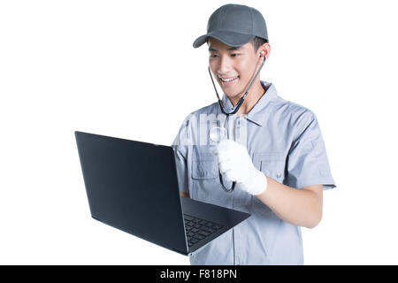 Engineer checking laptop Stock Photo