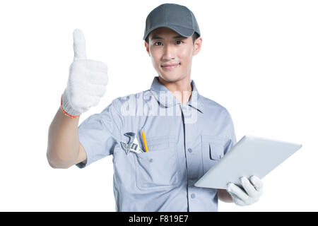 Repairman holding a digital tablet Stock Photo