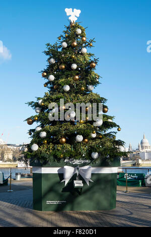 London, UK. 4th December, 2015. A 27ft fir tree created by beer brand Carlsberg dispenses beer to members of the public on London's Southbank today Credit:  Raymond Tang/Alamy Live News Stock Photo