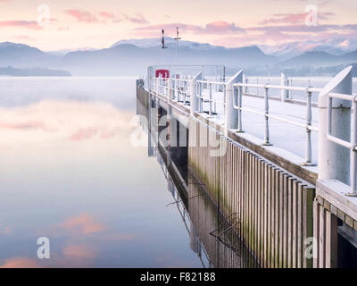 Ullswater jetty at Pooley Bridge on a frosty winter morning. Stock Photo