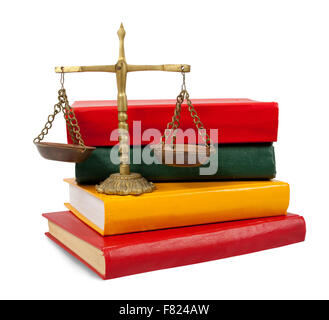 Scales of justice atop legal books over white Stock Photo